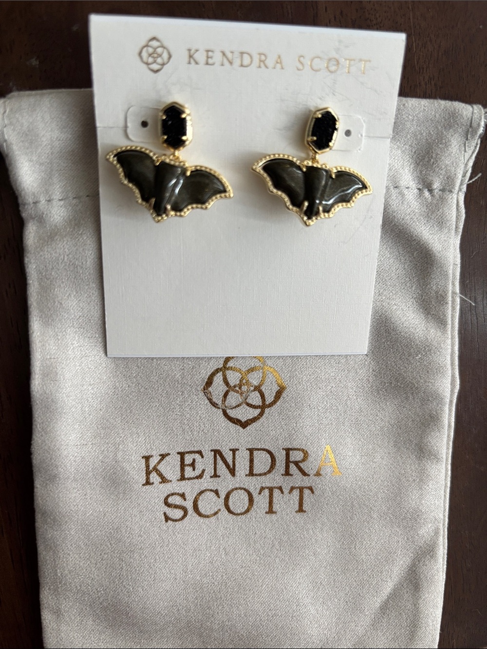Brand new Kendra Scott Black Bat Drop Earrings with Gold Trim